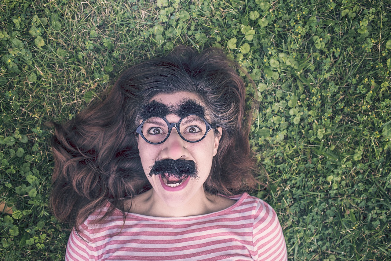 A girl wearing a funny mask